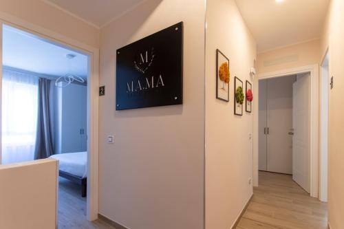 a hallway of a apartment with a door leading to a bedroom at MAMA GUEST HOUSE in Ciampino
