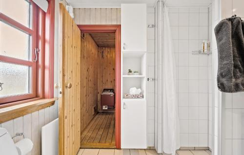 a bathroom with a toilet and a shower at 3 Bedroom Pet Friendly Home In Hvide Sande in Hvide Sande