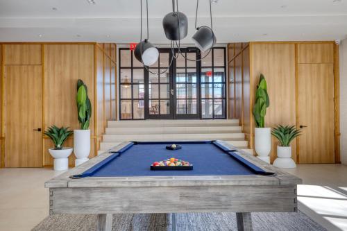 a pool table in the middle of a room at Dumbo 2br w wd roof gym nr TimeOut Building NYC-957 in Brooklyn