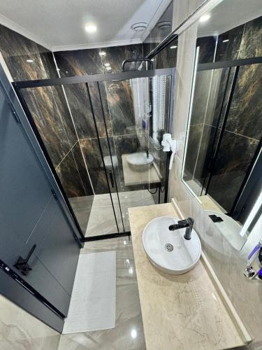 a bathroom with a sink and a shower at Garden House in Istanbul