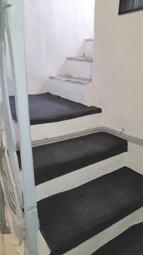 two bunk beds in a room with stairs at Casa Marina 50 mt dal mare in Imperia