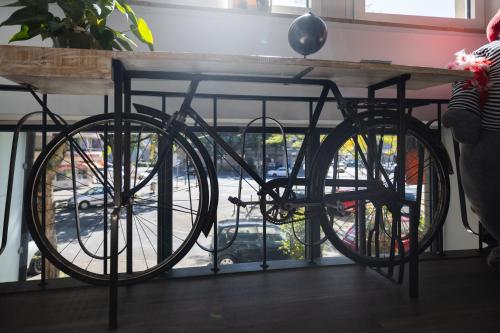 a bike parked under a table next to a window at Köln 2020 in Cologne