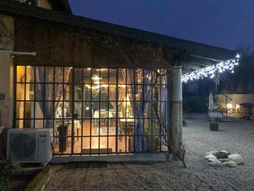 a building with a gate with lights on it at Agriturismo Helianthus in Oleggio