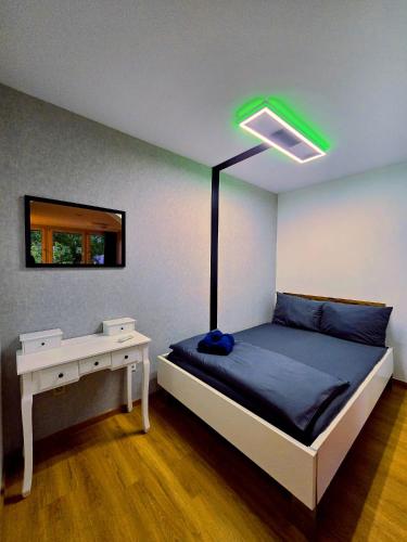 a bedroom with a bed with a lamp on it at B&R apartment türkischen Konsulats in Nürnberg