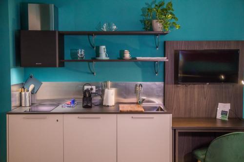 a kitchen with a sink and a counter top at Casa Consani in Ventimiglia