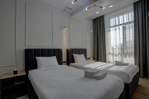 מיטה או מיטות בחדר ב-Aisha Hotel
