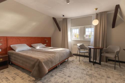 Posteľ alebo postele v izbe v ubytovaní Ołowianka B&B