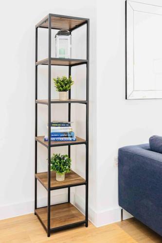 a black book shelf with two potted plants on it at Luxury SeaWay sleeps 12, playroom/xbox in Barton on Sea