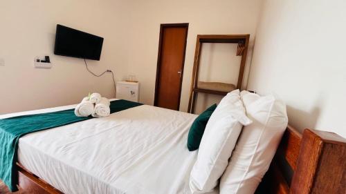 Cama o camas de una habitación en Pousada Enero