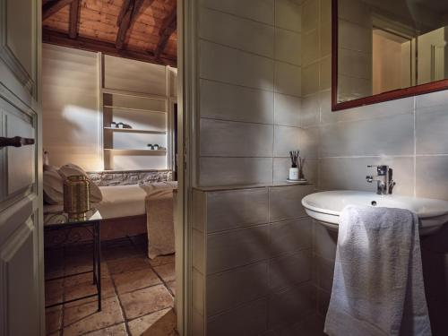 a bathroom with a sink and a toilet in it at Leeda's Village in Lithakia