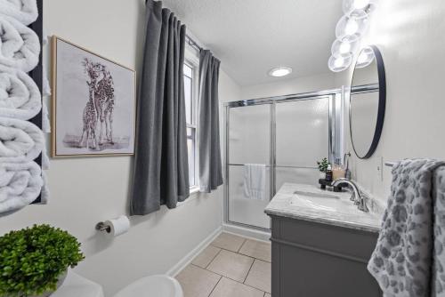 a bathroom with a sink and a shower at Charming Retreat in Cleveland in Cleveland