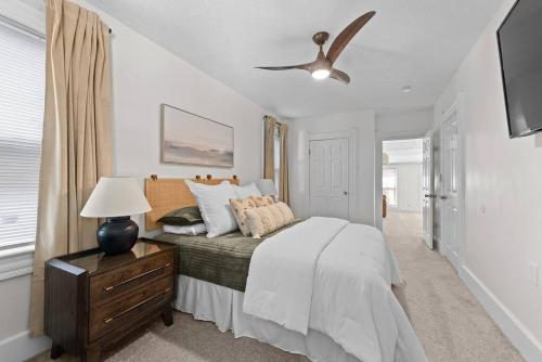 a bedroom with a bed and a ceiling fan at Charming Retreat in Cleveland in Cleveland