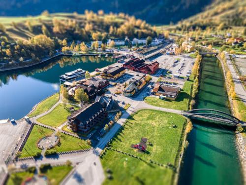 an aerial view of a town next to a river at Flåmsbrygga Hotel in Flåm