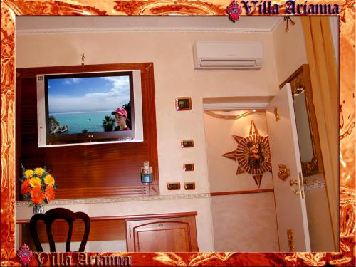 a room with a view of the ocean through a window at Villa Arianna B&B in Taormina
