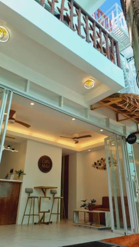 a room with a staircase with stools and a table at CiNta Hotel in Boracay