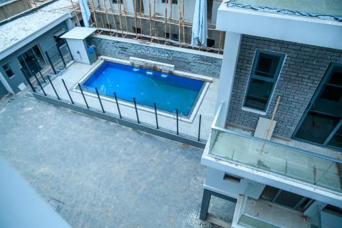 an overhead view of a swimming pool on a building at Elim Maisonette in Lekki