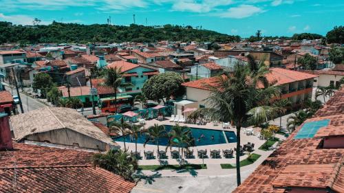 an aerial view of a city with a swimming pool at Hotel Fênix in Porto Seguro