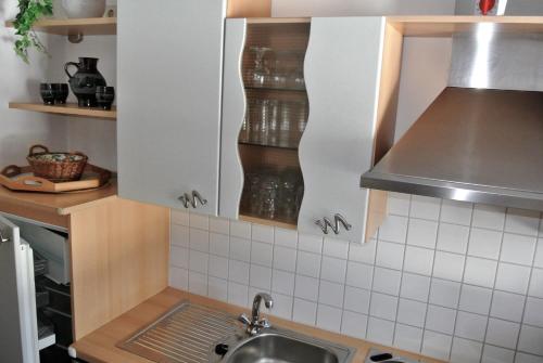 a kitchen with a sink and a counter top at ABCFeWo in Reit im Winkl