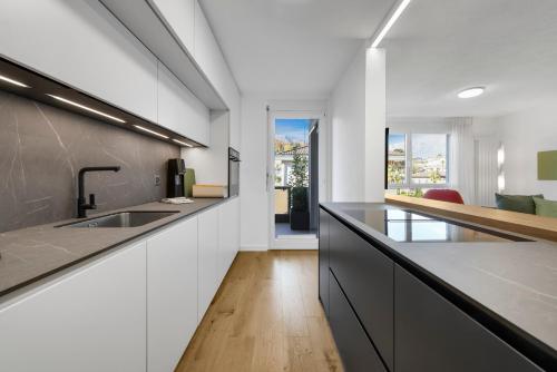 a kitchen with a sink and a counter top at Ferienwohnung Ascona Vista Verde in Ascona