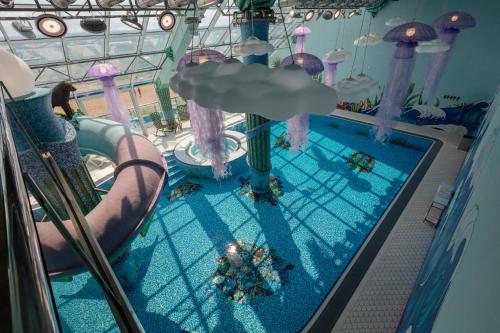 an overhead view of a swimming pool on a cruise ship at UnderSun Spa Hotel in Gribovka
