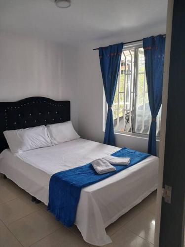 Кровать или кровати в номере Alojamiento en Armenia