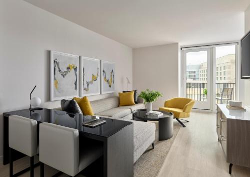 a living room with a couch and a table at Hotel AKA Washington Circle in Washington