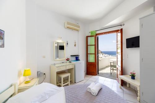 Postel nebo postele na pokoji v ubytování Froudi Rooms