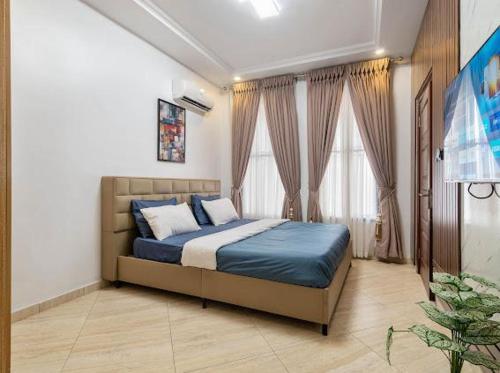 Katil atau katil-katil dalam bilik di Afatex apartments