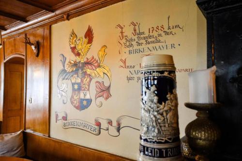a wall with writing on the side of a room at Gasthof zum Ritter - a cozy historical Landmark in Ulm