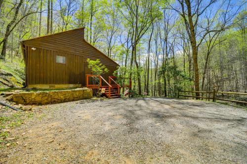 a small cabin in the middle of the woods at Creekside Cabin with Deck and Grill in Whittier! in Whittier