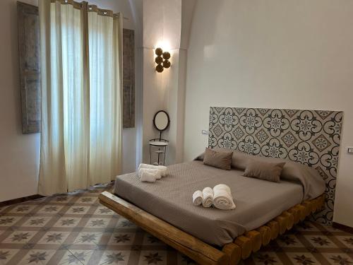 Кровать или кровати в номере La casa di Patty