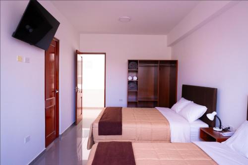 Postel nebo postele na pokoji v ubytování Bruan Hotel