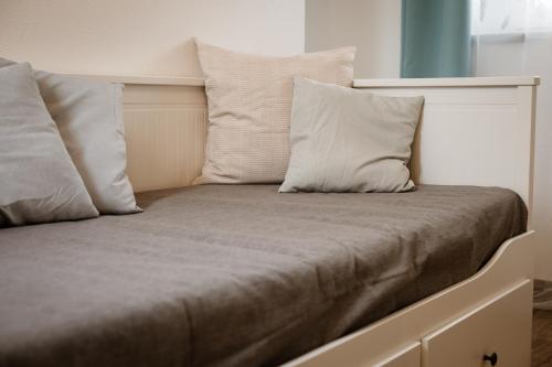 a bed with two pillows on top of it at Palazzo Campia in Cortandone