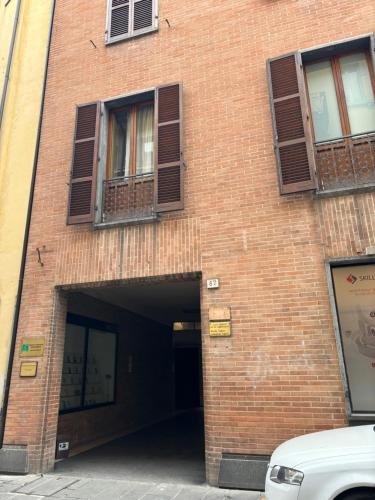 a brick building with a tunnel in it at Camere di Bianca in Foligno