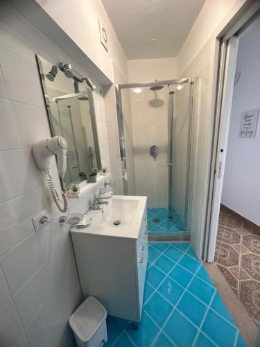 a bathroom with a sink and a shower at Sweet Home Positano in Positano