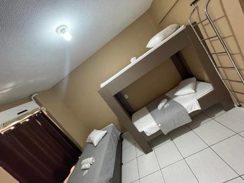 Letto o letti in una camera di HOTEL SAYMON