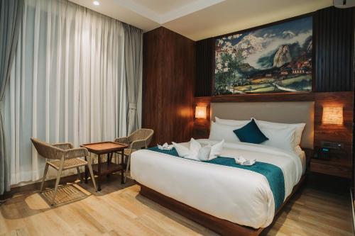Postel nebo postele na pokoji v ubytování Dees Boutique Hotel