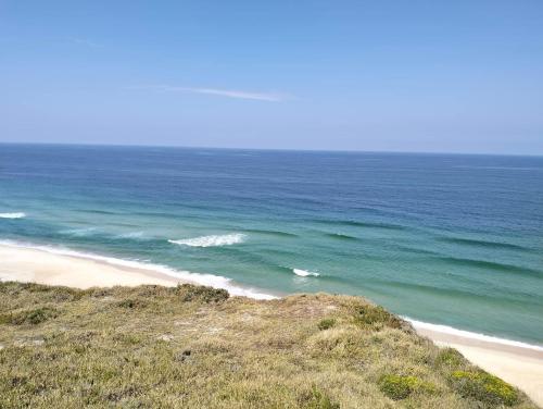 a view of a beach with the ocean at GoldBeach House in Pataias