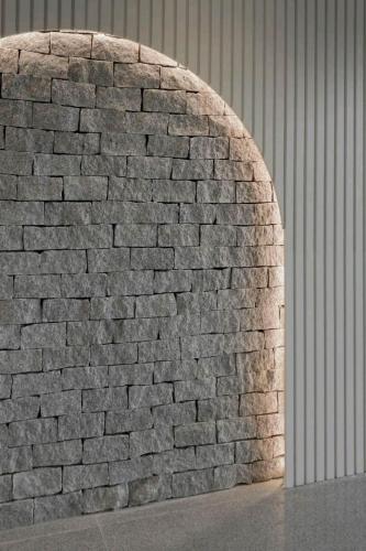 a brick wall with an arch in a building at Twin Hearts Residences Unit 215 in Roxas City