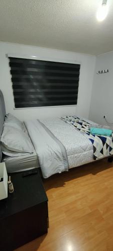 Katil atau katil-katil dalam bilik di Habitaciones en Curico