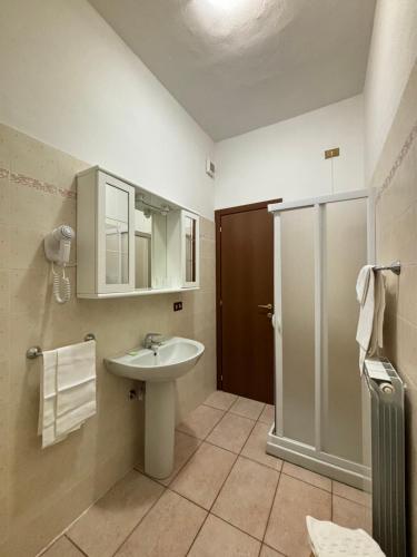 a bathroom with a sink and a shower at Albergo Dolcedo in Imperia