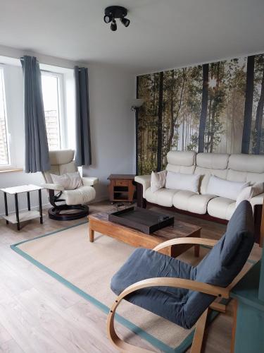 Ein Sitzbereich in der Unterkunft Gîte Pouget