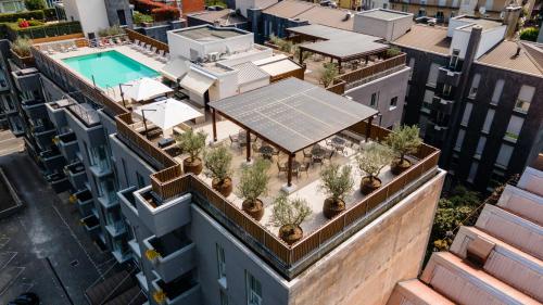 an overhead view of a building with plants on the roof at Hotel Como in Como