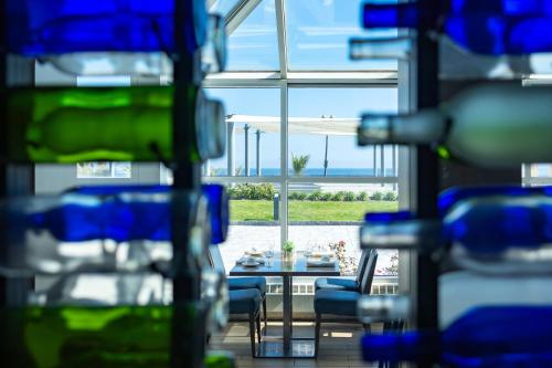 a room with a table and chairs and a window at Ocean Place Resort & Spa in Long Branch