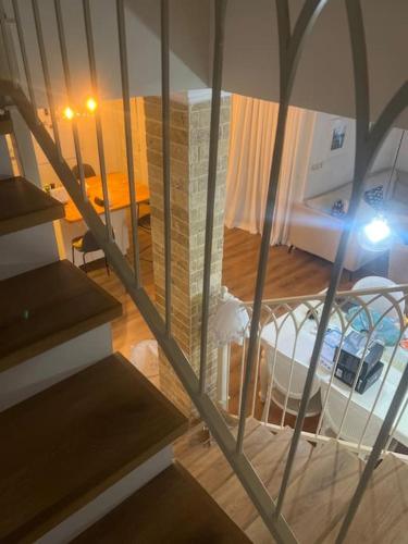 a view of a room with a bed and a staircase at בית כפרי בנורדיה in Gannot Hadar