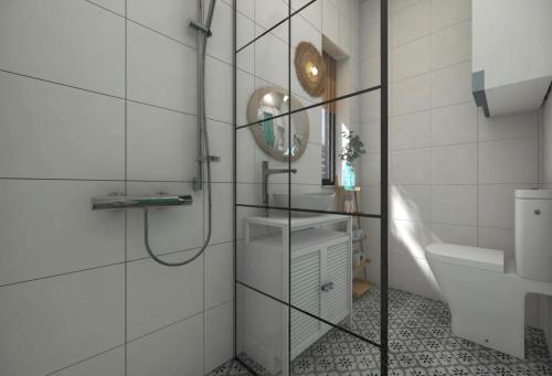 a bathroom with a shower and a sink and a mirror at Lulu Holiday Resort domki z podgrzewanym Basenem in Mielno