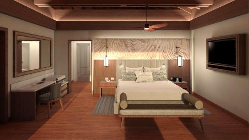 1 dormitorio con cama, escritorio y lavamanos en Royalton CHIC Antigua All-Inclusive Resort - Adults Only, en Saint Johnʼs