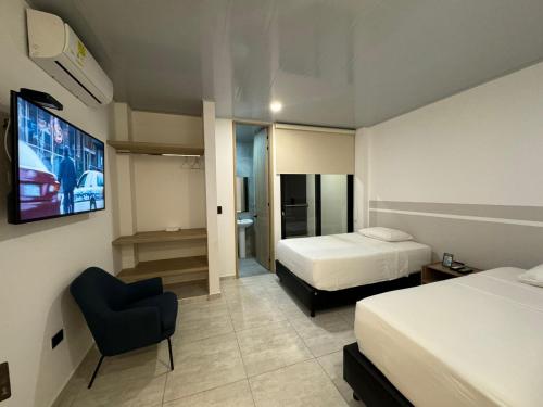 Postel nebo postele na pokoji v ubytování RB Hotel