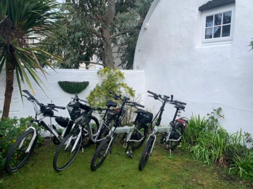 a group of bikes parked next to a building at The Pigsty in Braunton in Braunton