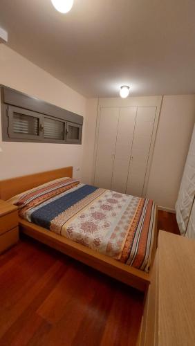 a bedroom with a bed in a room at Duplex GABY in Sabiñánigo